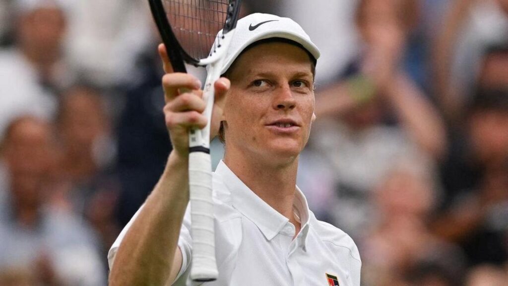 Jannik Sinner lines up for a powerful serve at Wimbledon 2025.