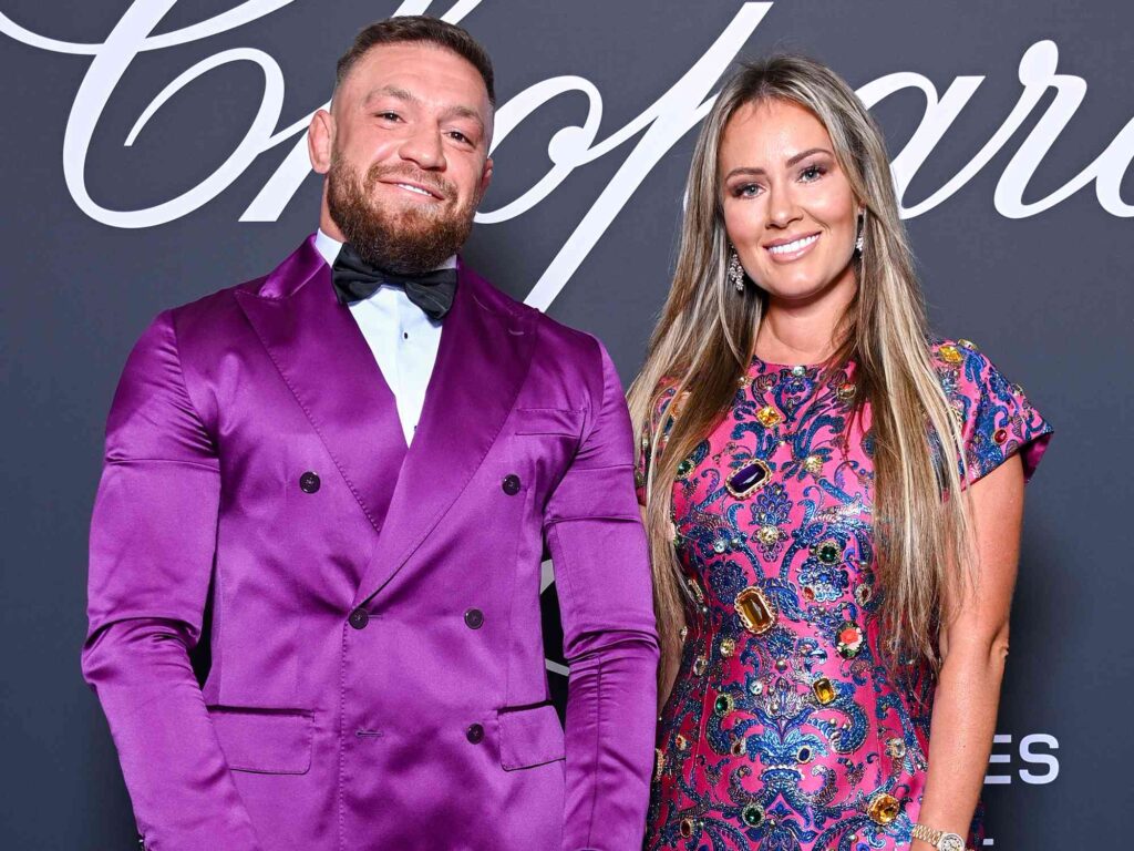 Dee Devlin, Conor McGregor’s wife, attending an event with her husband, showing her role as a supportive partner.